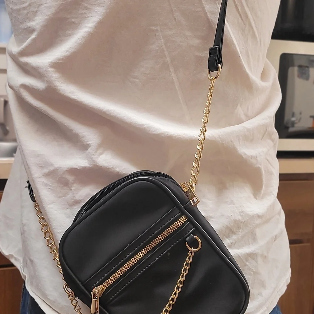 Elegant Black Crossbody Bag with Gold Accents